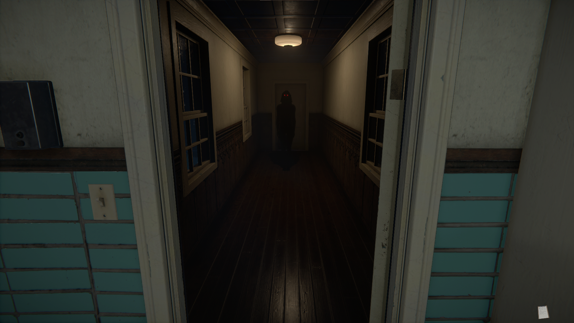 The Mortuary Assistant 1 - A ruby-eyed silhouette ominously stands at the end of the hall.